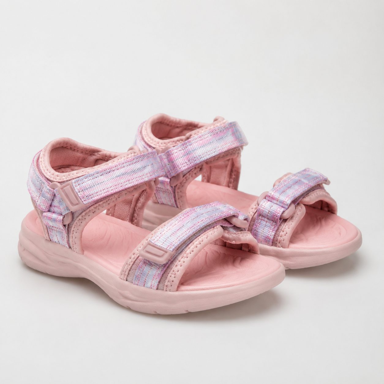 Kids' sandals with soft straps and a hook-and-loop closure on a neutral background