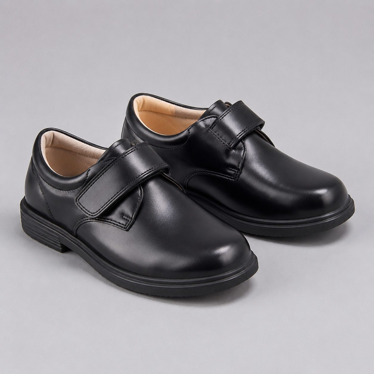 Children's black school shoes with a polished upper and formal silhouette