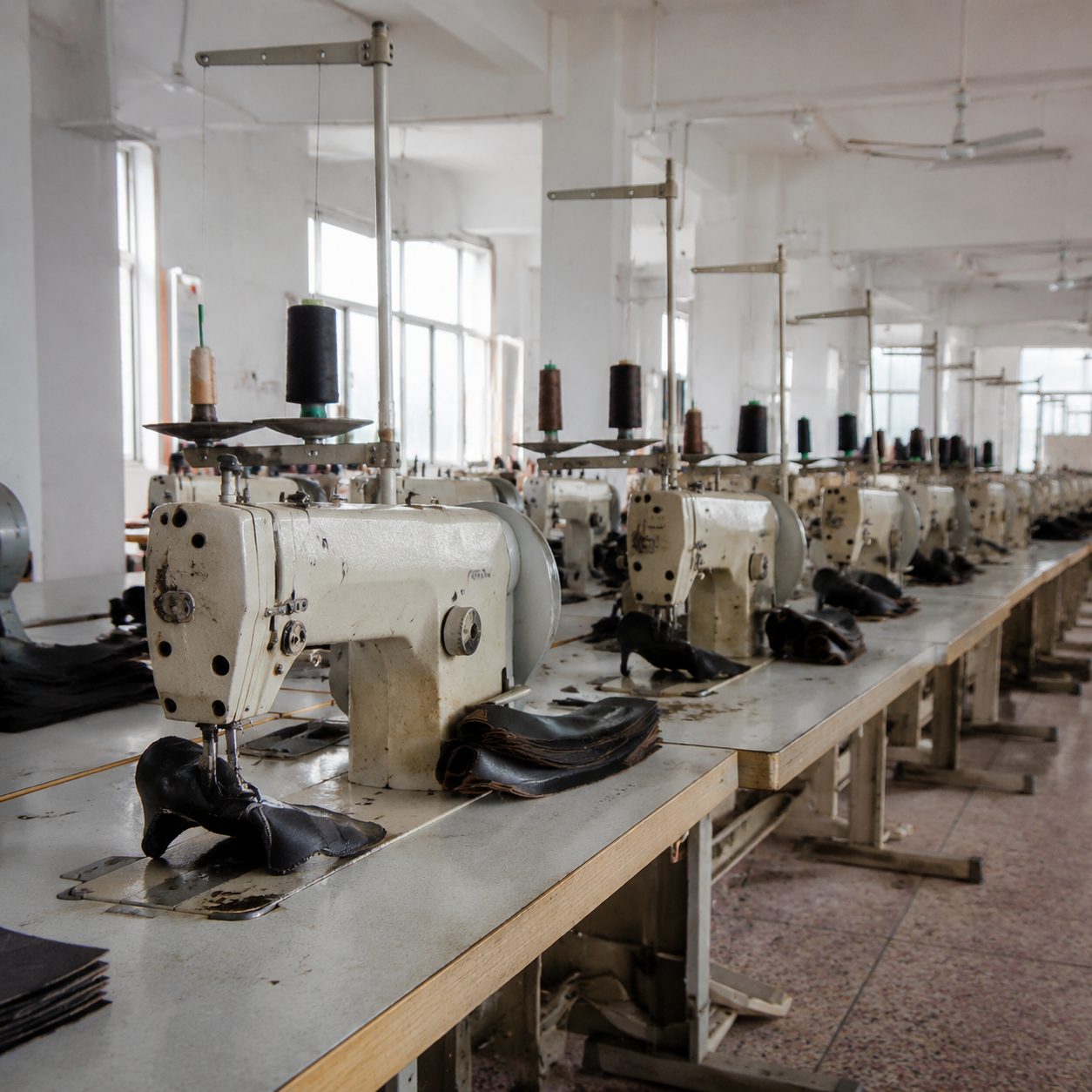 Row of industrial sewing machines on the stitching line